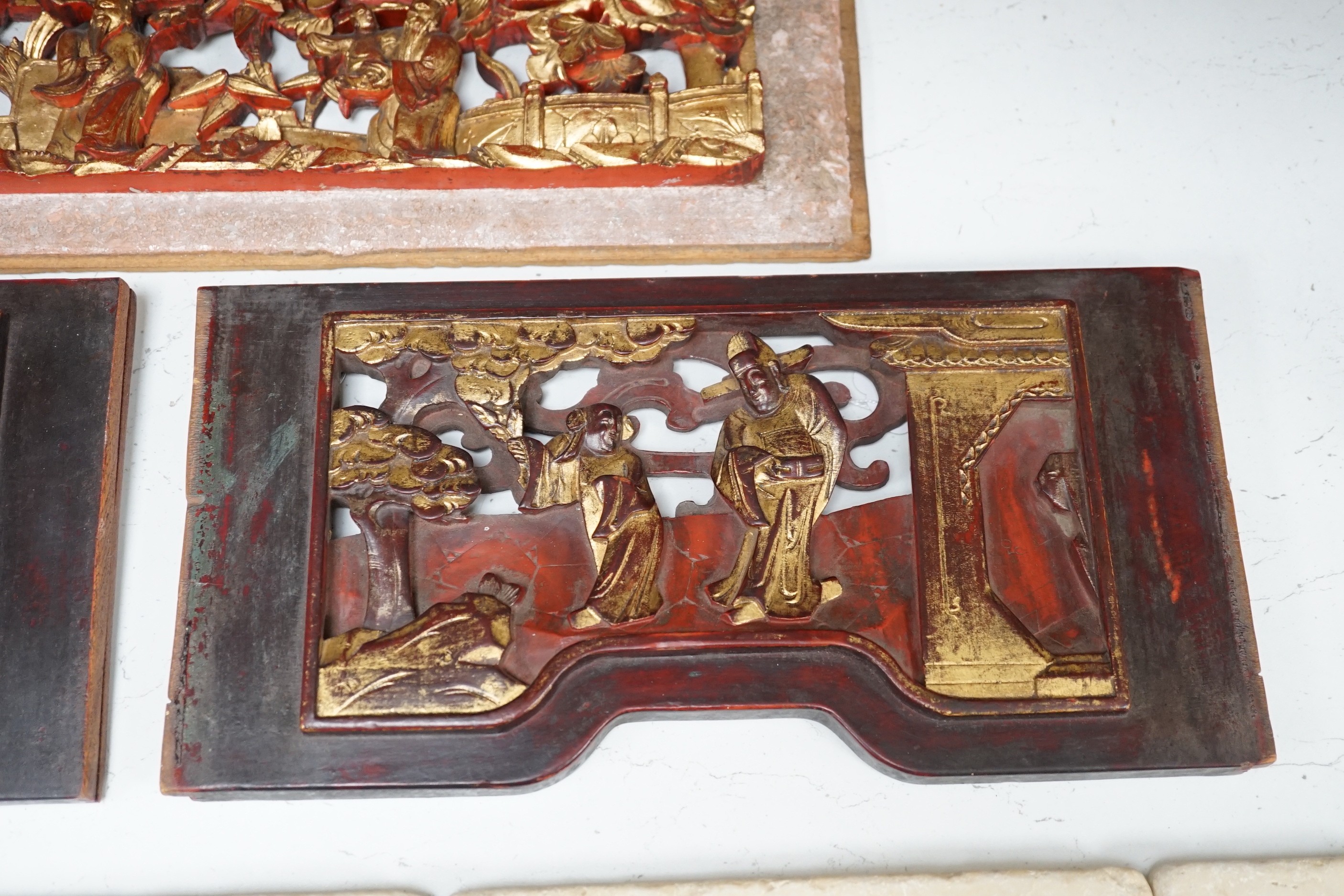 Two South East Asian carved hardwood panels together with three Chinese gilt wood panels (5) largest 6x91cm